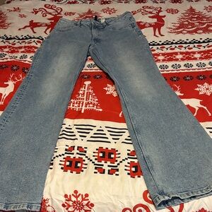 H & M stonewashed Light Blue Flared Jeans. Highrise with stretch. Inseam 31"